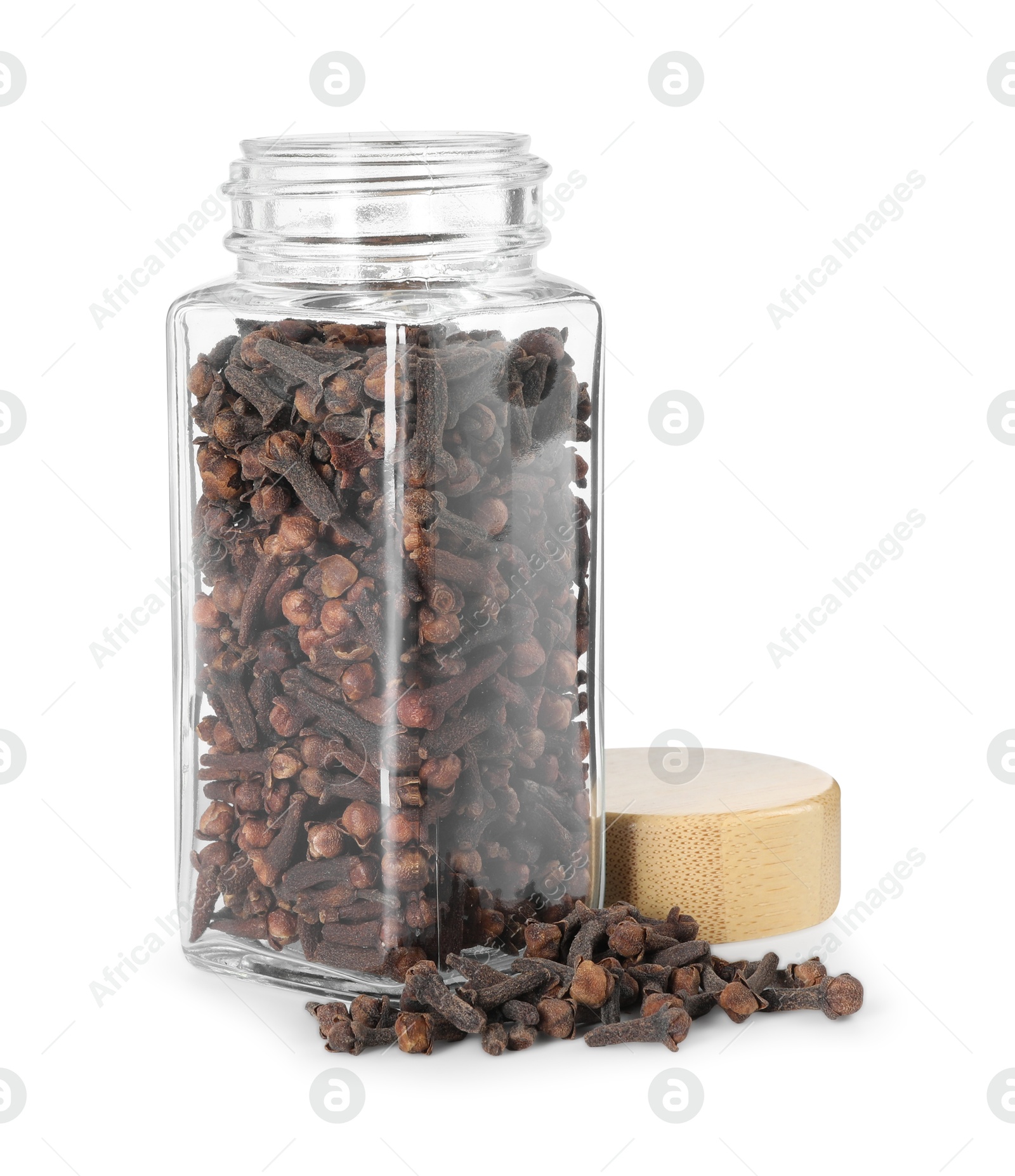 Photo of Clove buds in glass jar isolated on white