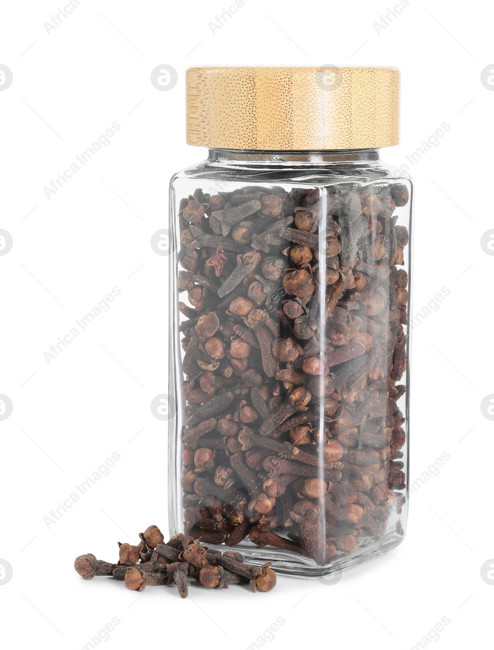 Photo of Clove buds in glass jar isolated on white