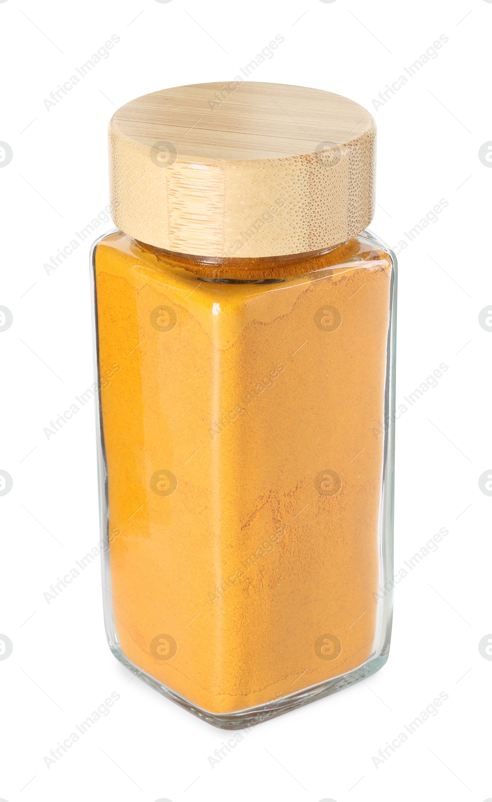 Photo of Curry powder in glass jar isolated on white