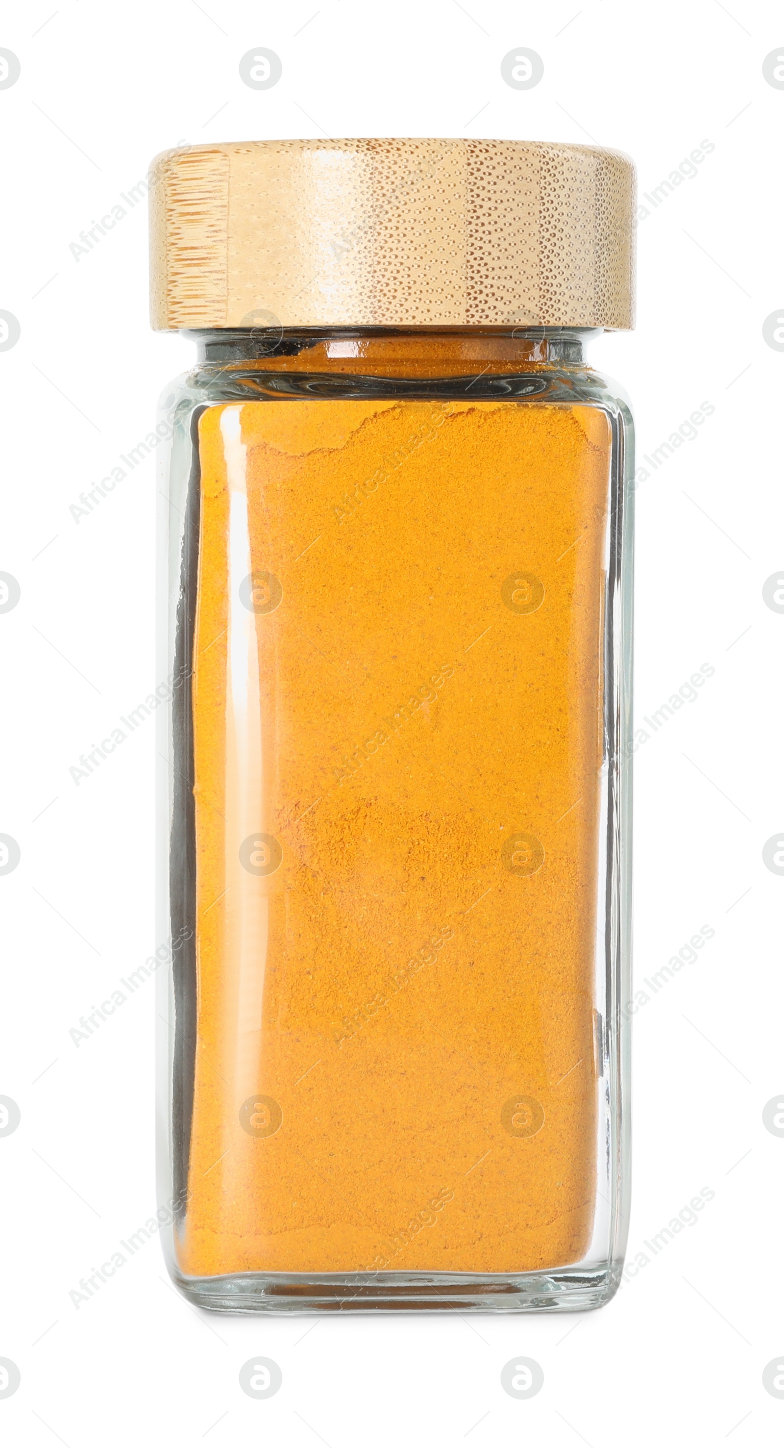 Photo of Curry powder in glass jar isolated on white