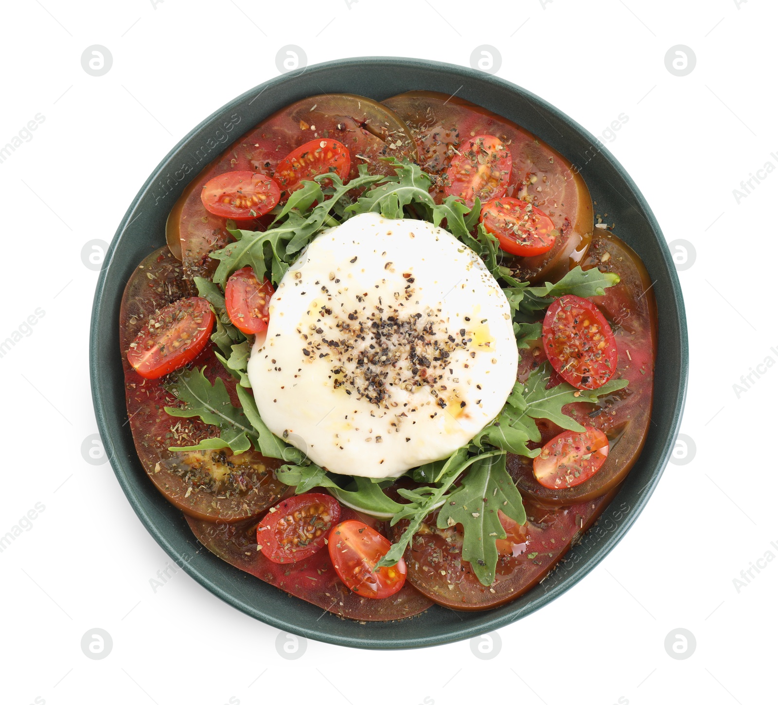 Photo of Delicious fresh burrata salad in bowl isolated on white