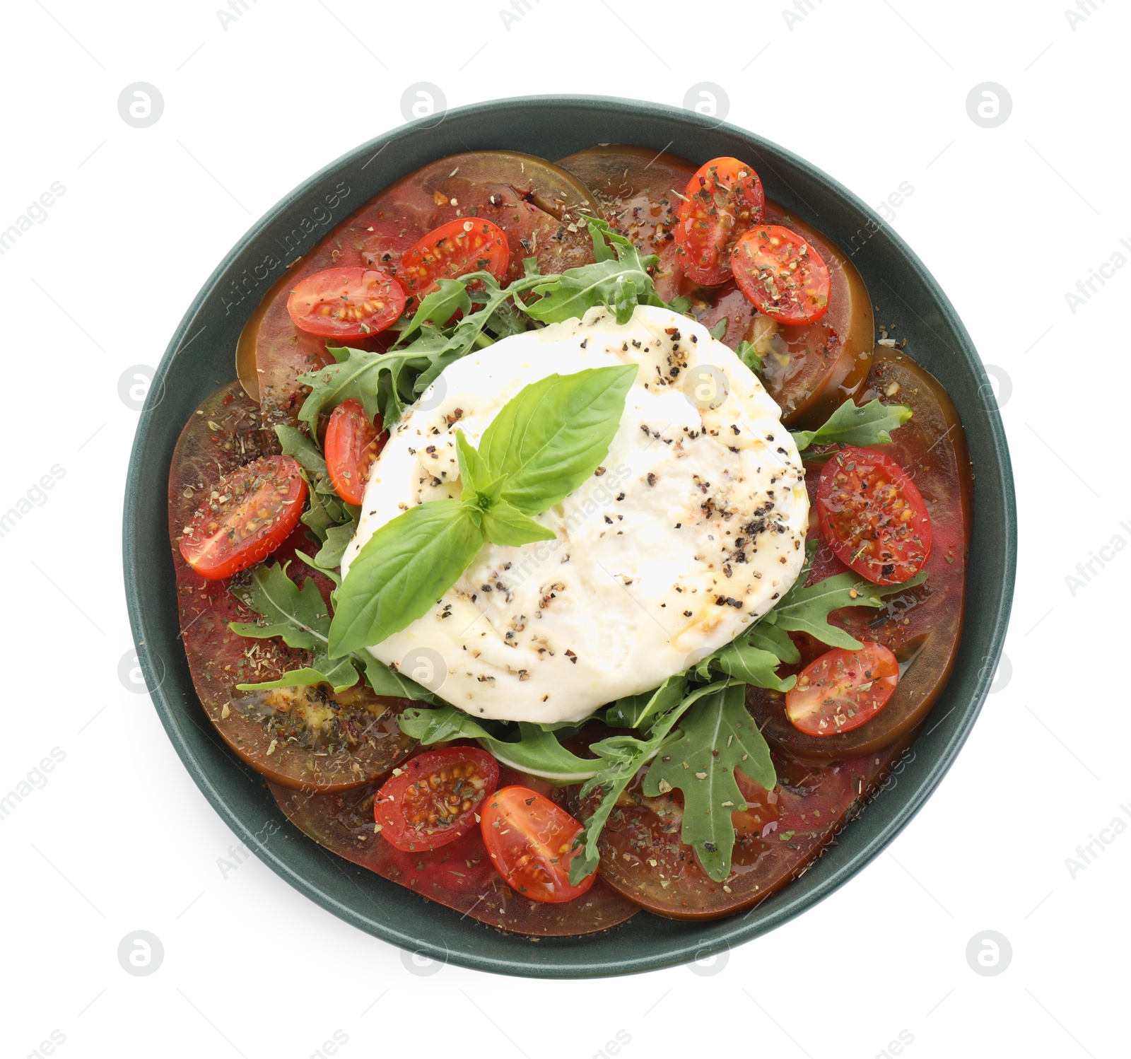 Photo of Delicious fresh burrata salad in bowl isolated on white