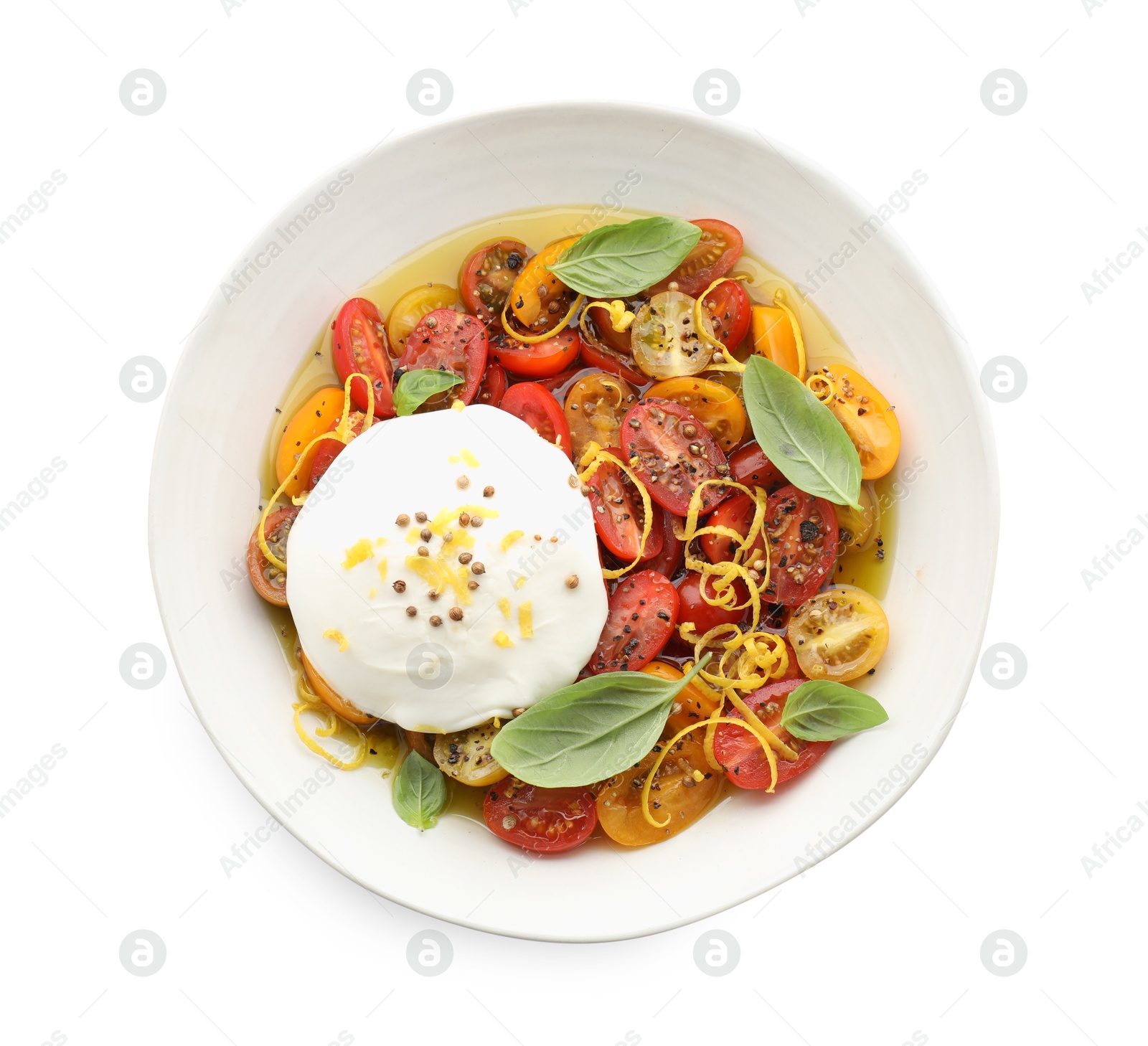 Photo of Delicious fresh burrata salad in bowl isolated on white, top view