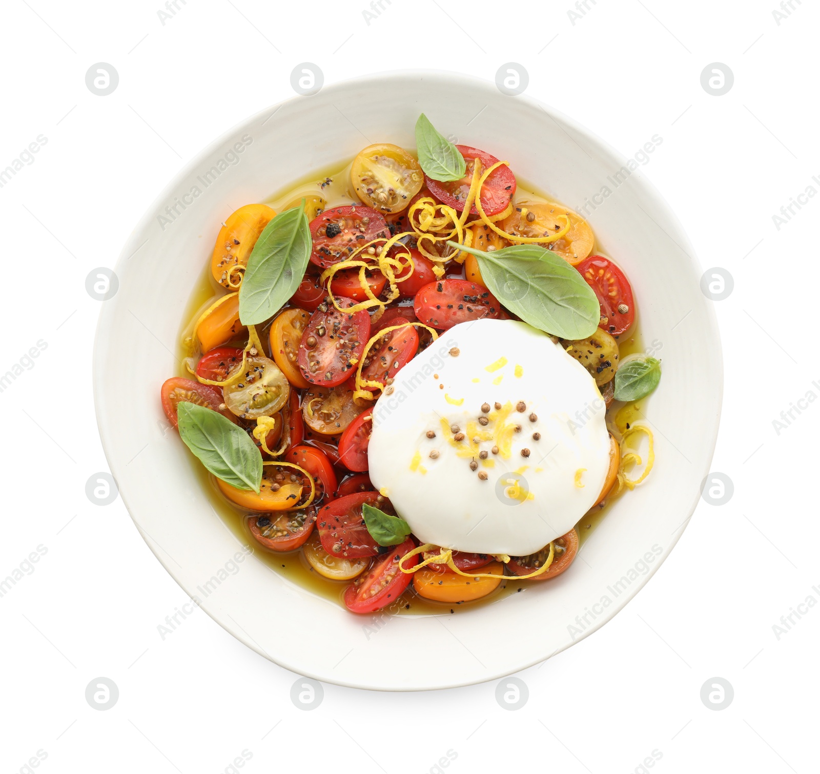 Photo of Delicious fresh burrata salad in bowl isolated on white, top view