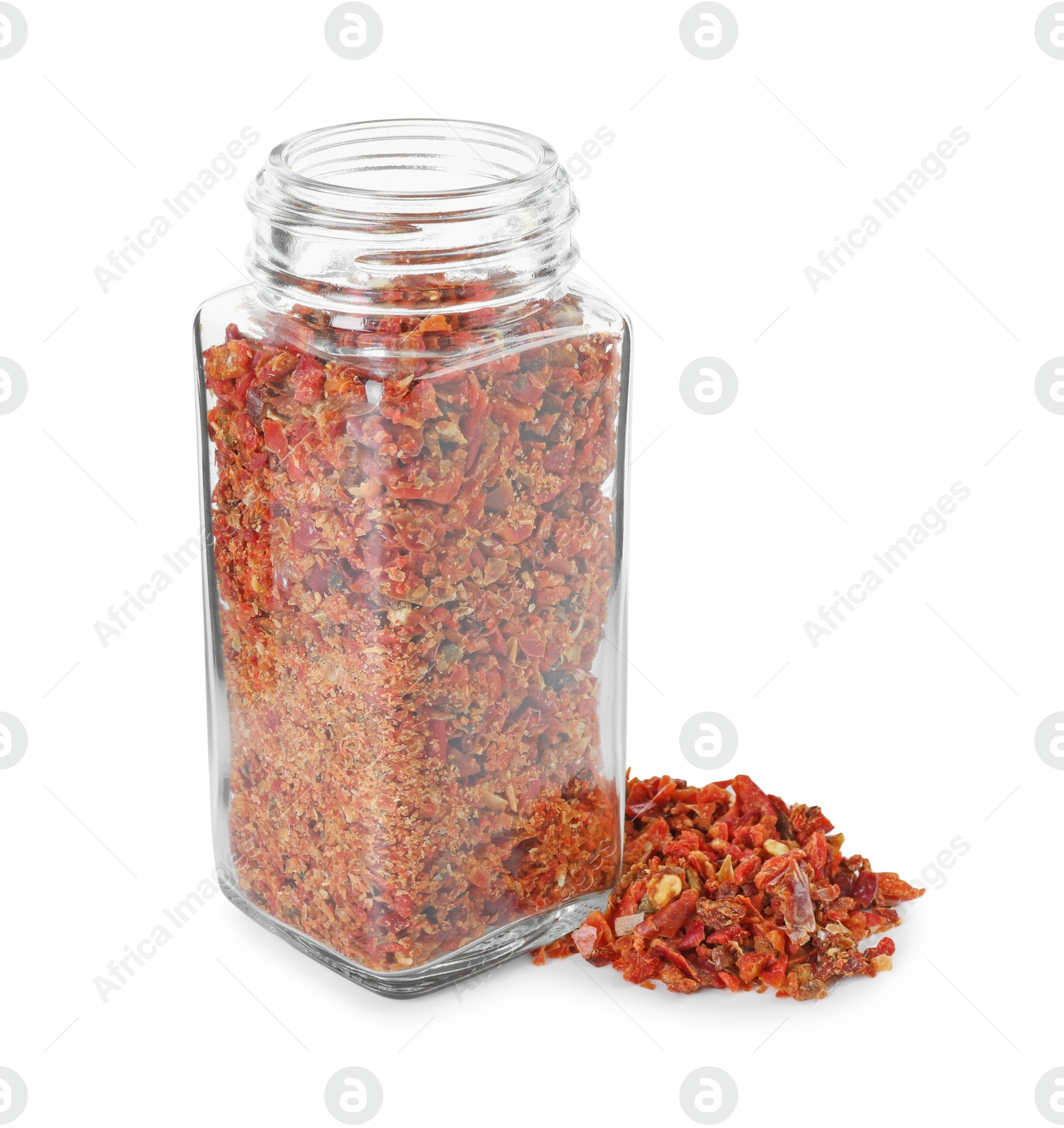 Photo of Red chili pepper flakes and glass jar isolated on white