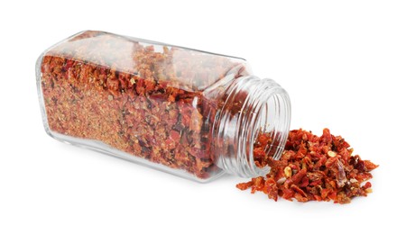 Photo of Red chili pepper flakes and glass jar isolated on white