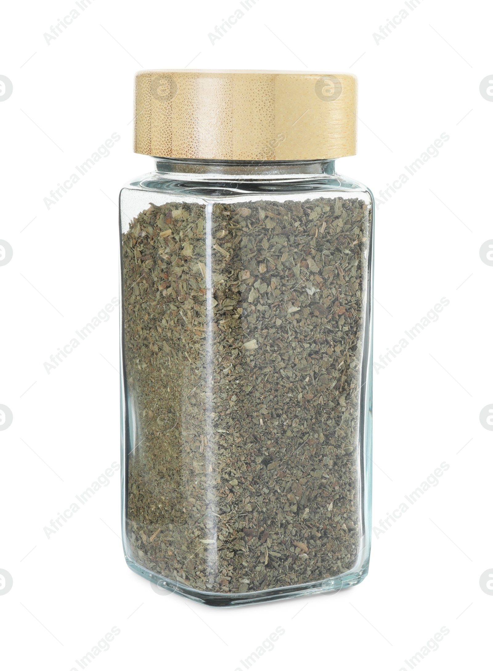 Photo of Dry basil in glass jar isolated on white