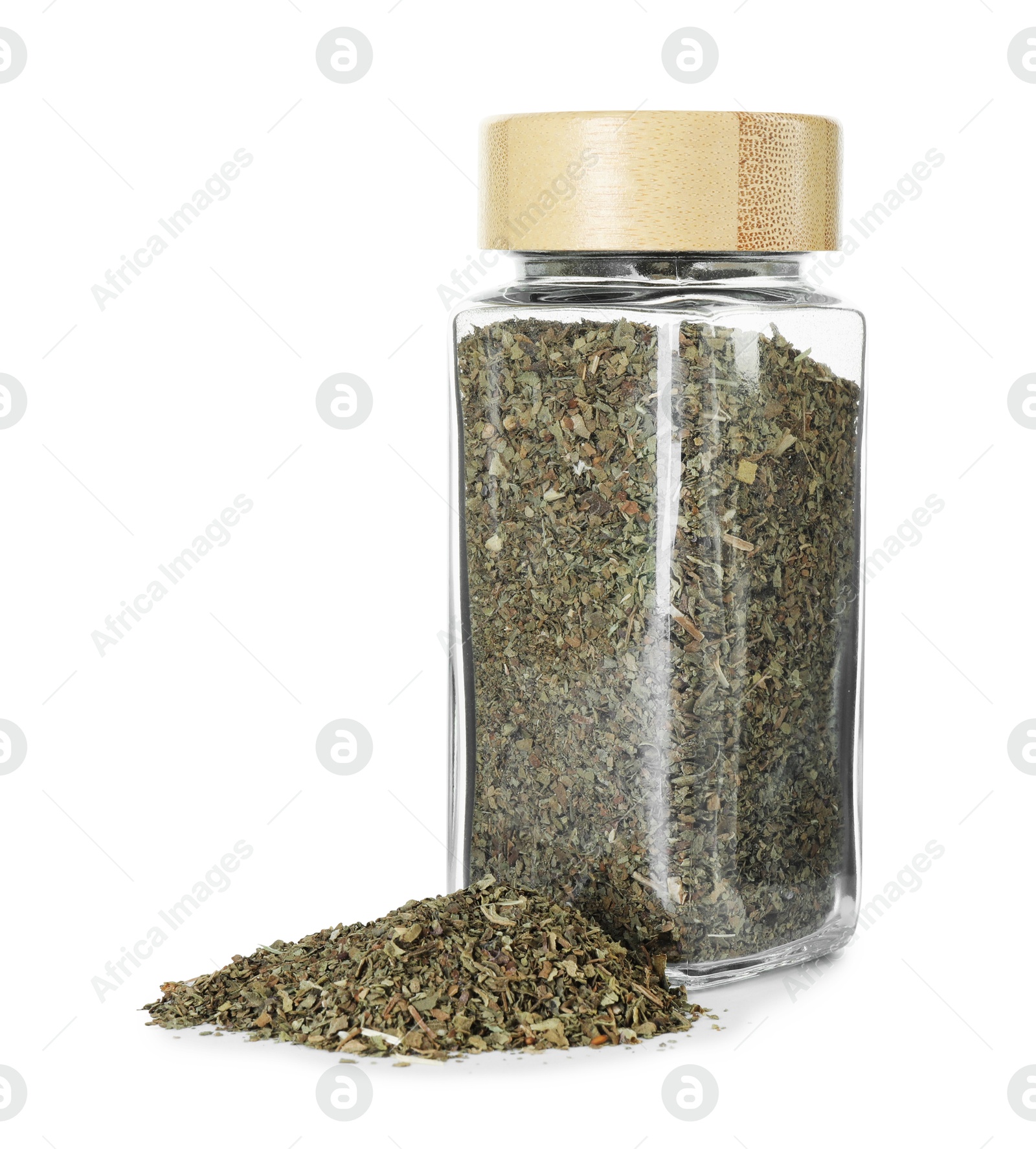 Photo of Dry basil in glass jar isolated on white