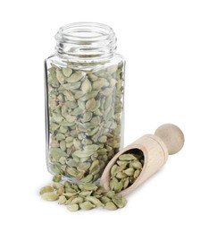 Photo of Cardamom seeds in glass jar and scoop isolated on white