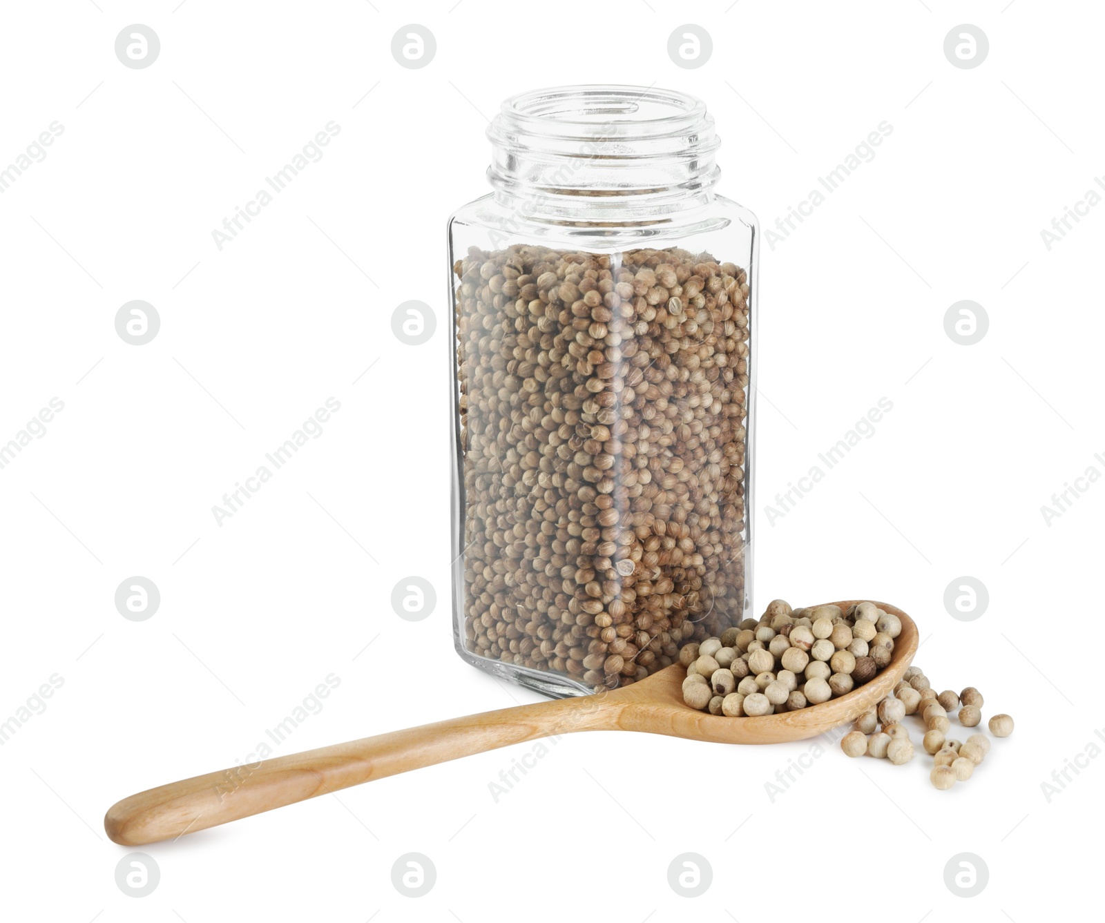 Photo of Coriander in glass jar and spoon isolated on white