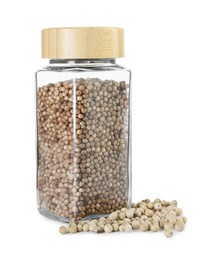 Photo of Coriander in glass jar isolated on white