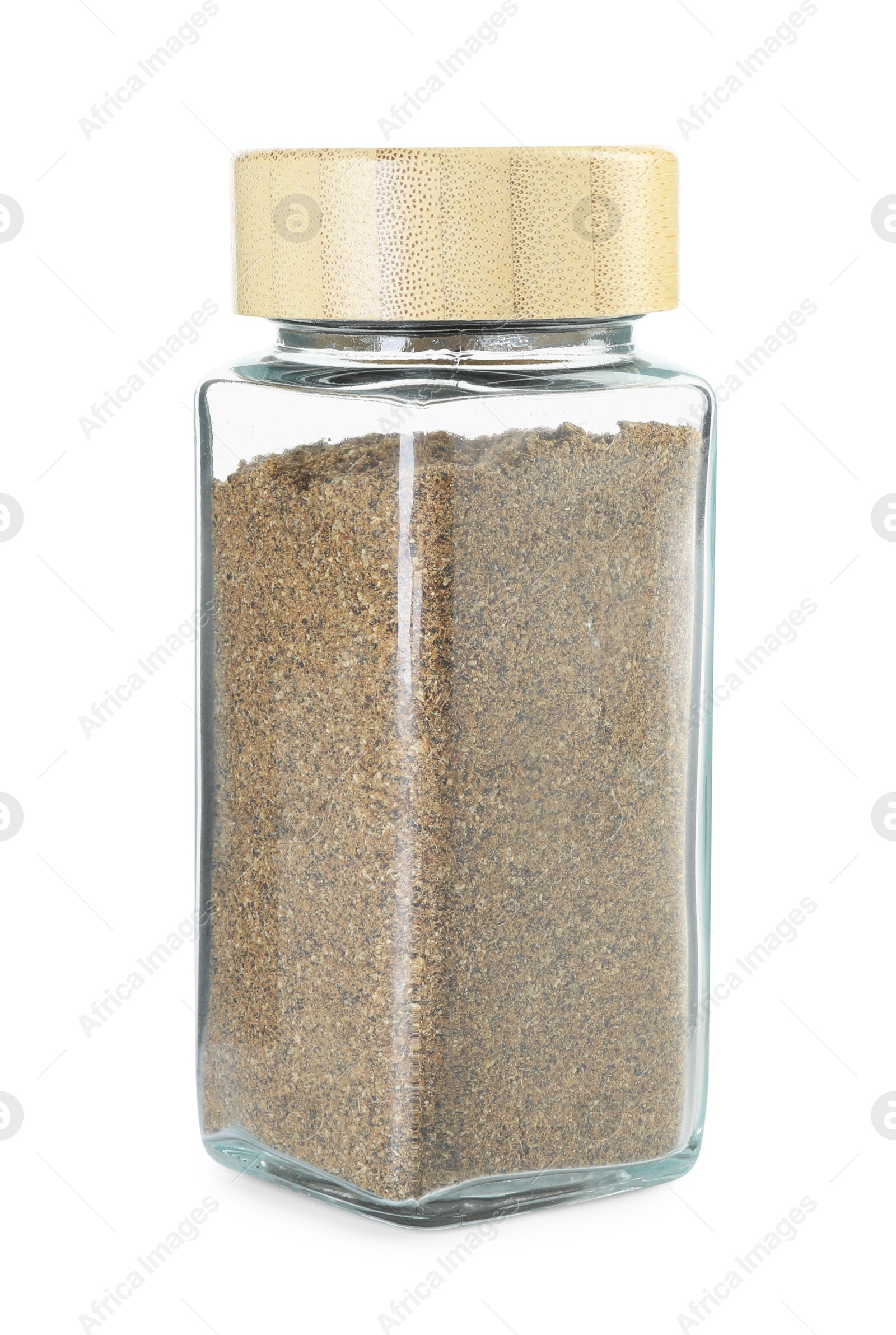 Photo of Cumin powder in glass jar isolated on white