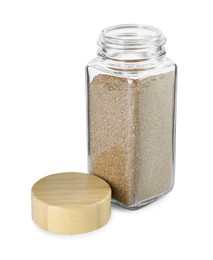 Photo of Cumin powder in glass jar isolated on white