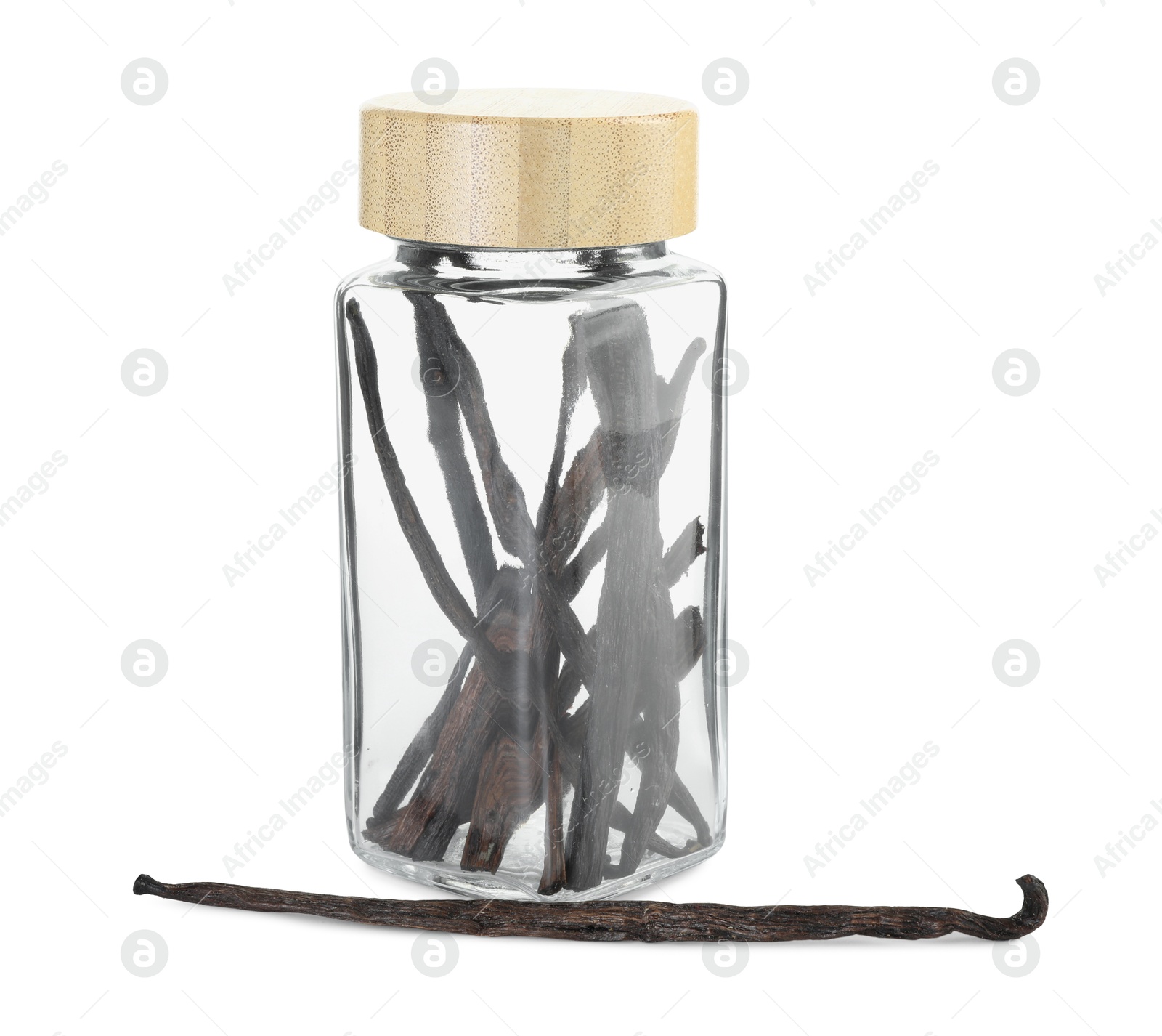 Photo of Vanilla pods in glass jar isolated on white