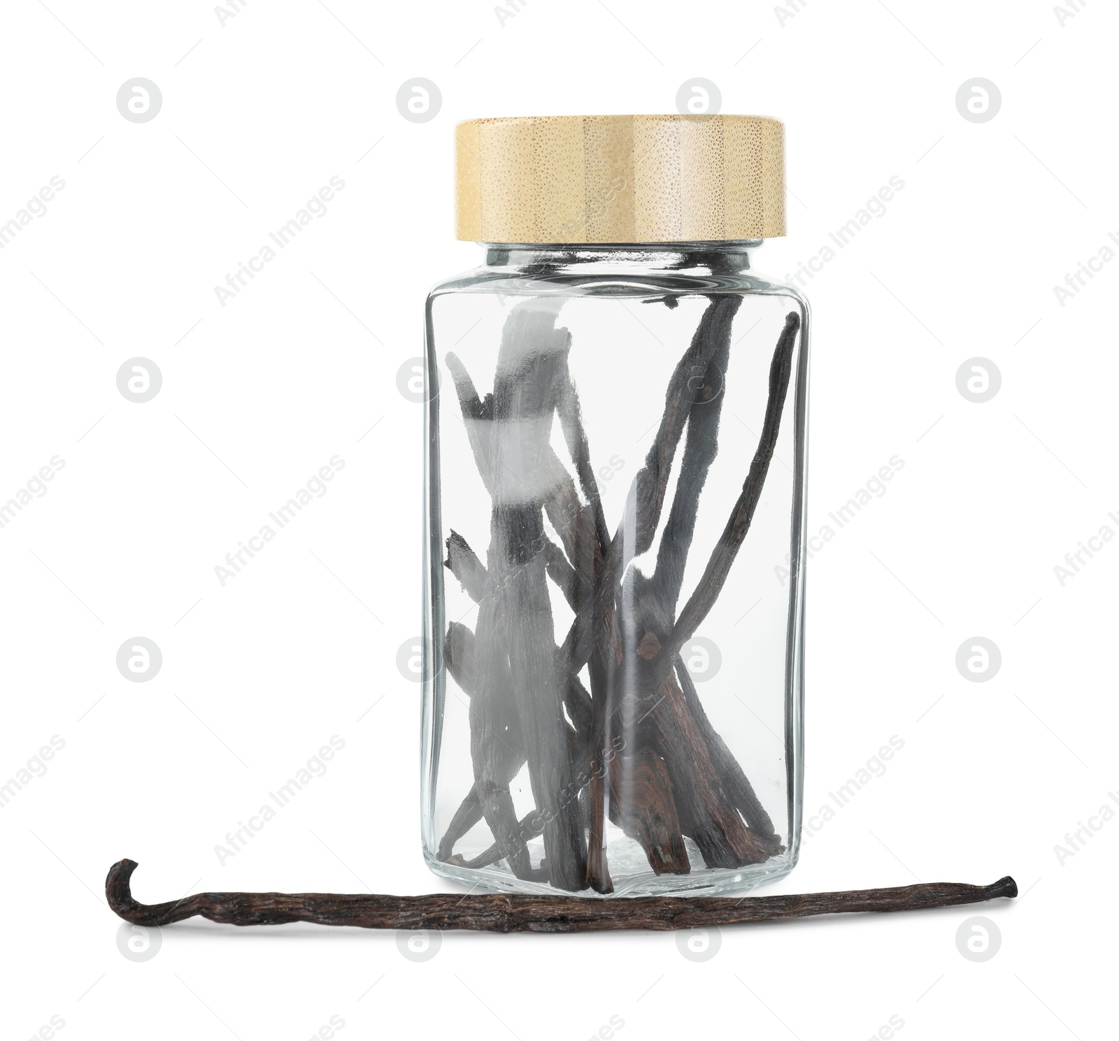 Photo of Vanilla pods in glass jar isolated on white