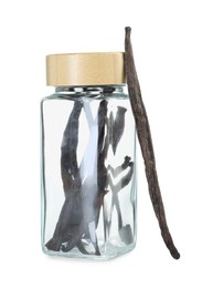 Photo of Vanilla pods in glass jar isolated on white