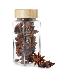 Photo of Anise stars in glass jar isolated on white