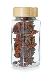 Photo of Anise stars in glass jar isolated on white