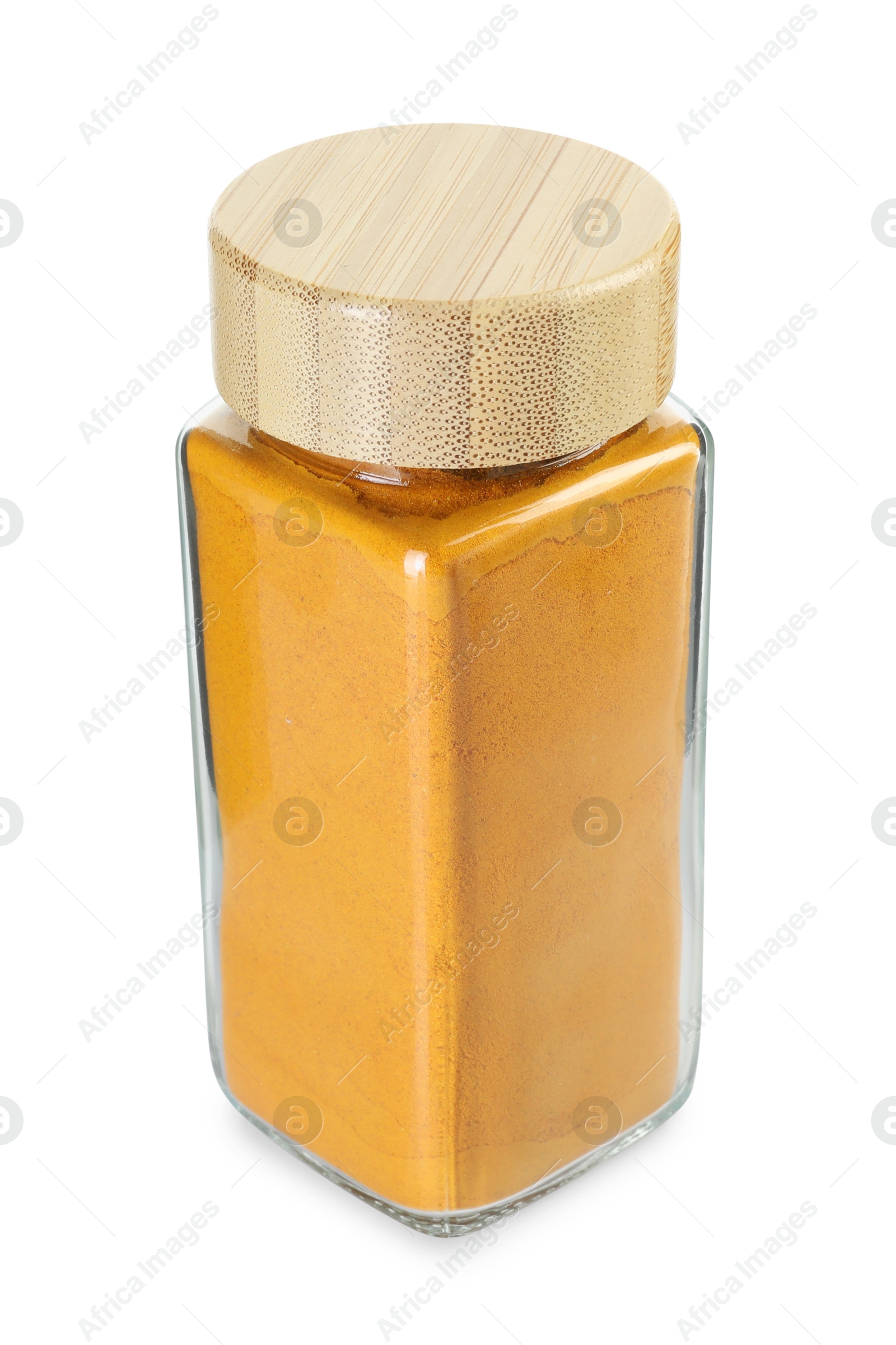 Photo of Curry powder in glass jar isolated on white