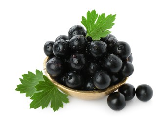 Fresh ripe black currant berries with leaves isolated on white