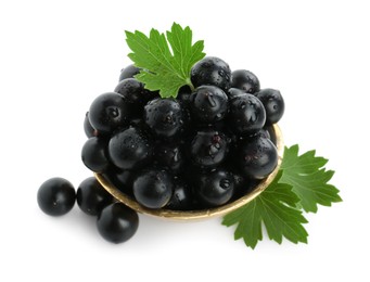 Fresh ripe black currant berries with leaves isolated on white