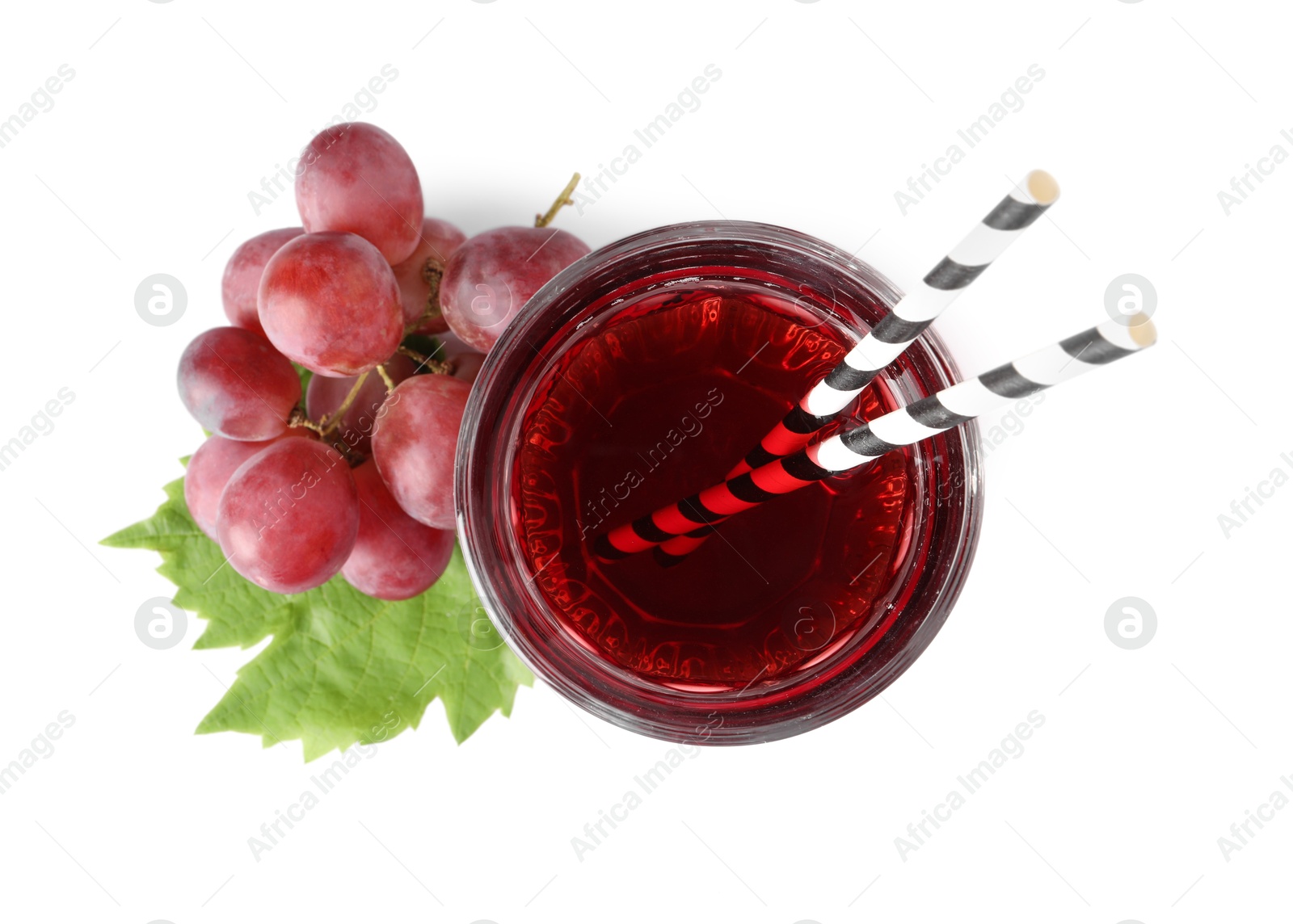 Photo of Tasty grape juice, straws, leaf and berries isolated on white, top view