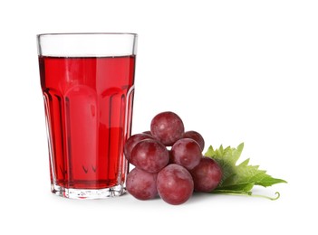 Photo of Tasty grape juice in glass, leaf and berries isolated on white