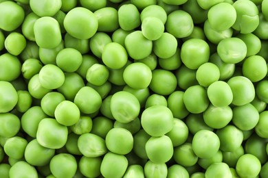 Photo of Fresh green peas as background, top view