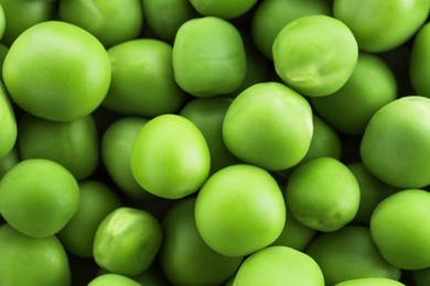 Photo of Fresh green peas as background, top view