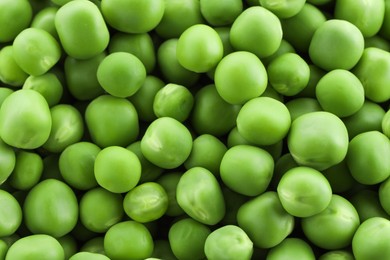 Photo of Fresh green peas as background, top view