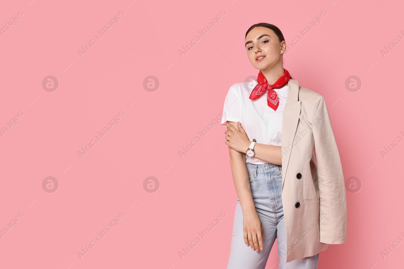 Photo of Stylish woman in beige jacket and jeans on pink background, space for text