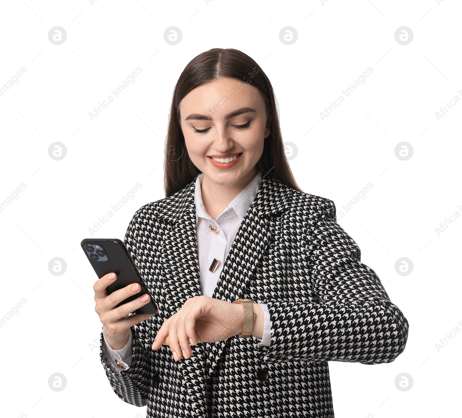 Photo of Beautiful woman in stylish suit with smartphone looking at wristwatch on white background