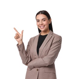 Photo of Beautiful woman in beige suit pointing at something on white background