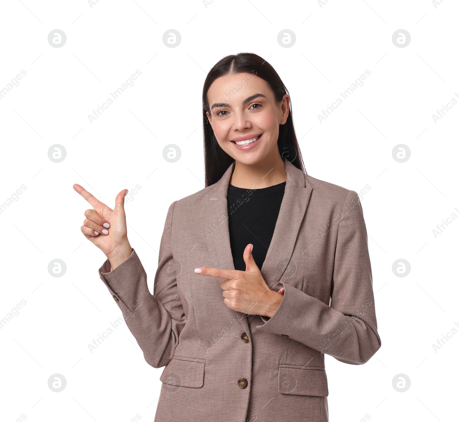 Photo of Beautiful woman in beige suit pointing at something on white background