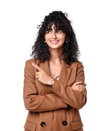 Beautiful young woman in stylish suit pointing at something on white background