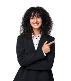 Beautiful young woman in black suit pointing at something on white background