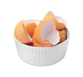 Photo of Broken eggshells in bowl isolated on white