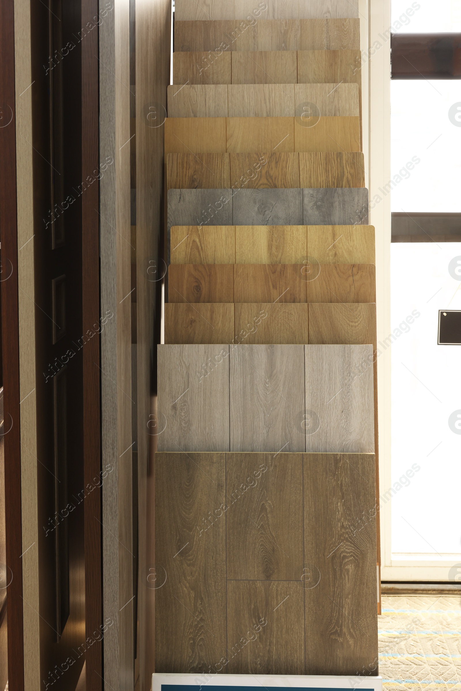 Photo of Many different samples of wooden flooring in store