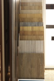 Photo of Many different samples of wooden flooring in store