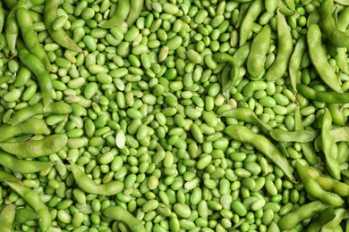 Photo of Fresh edamame beans and pods as background, top view