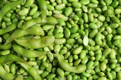 Photo of Fresh edamame beans and pods as background, top view