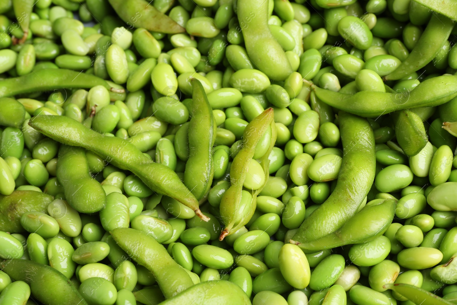 Photo of Fresh edamame beans and pods as background, above view