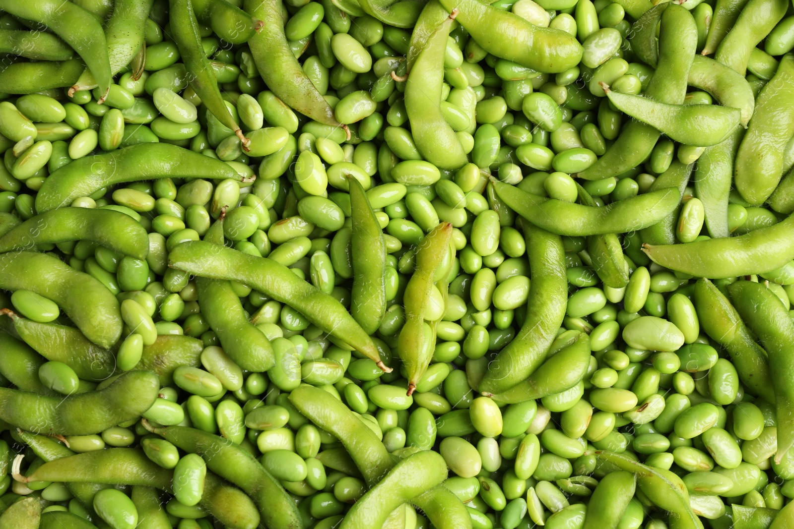 Photo of Fresh edamame beans and pods as background, top view