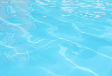 Photo of Clear water in outdoor swimming pool on sunny day