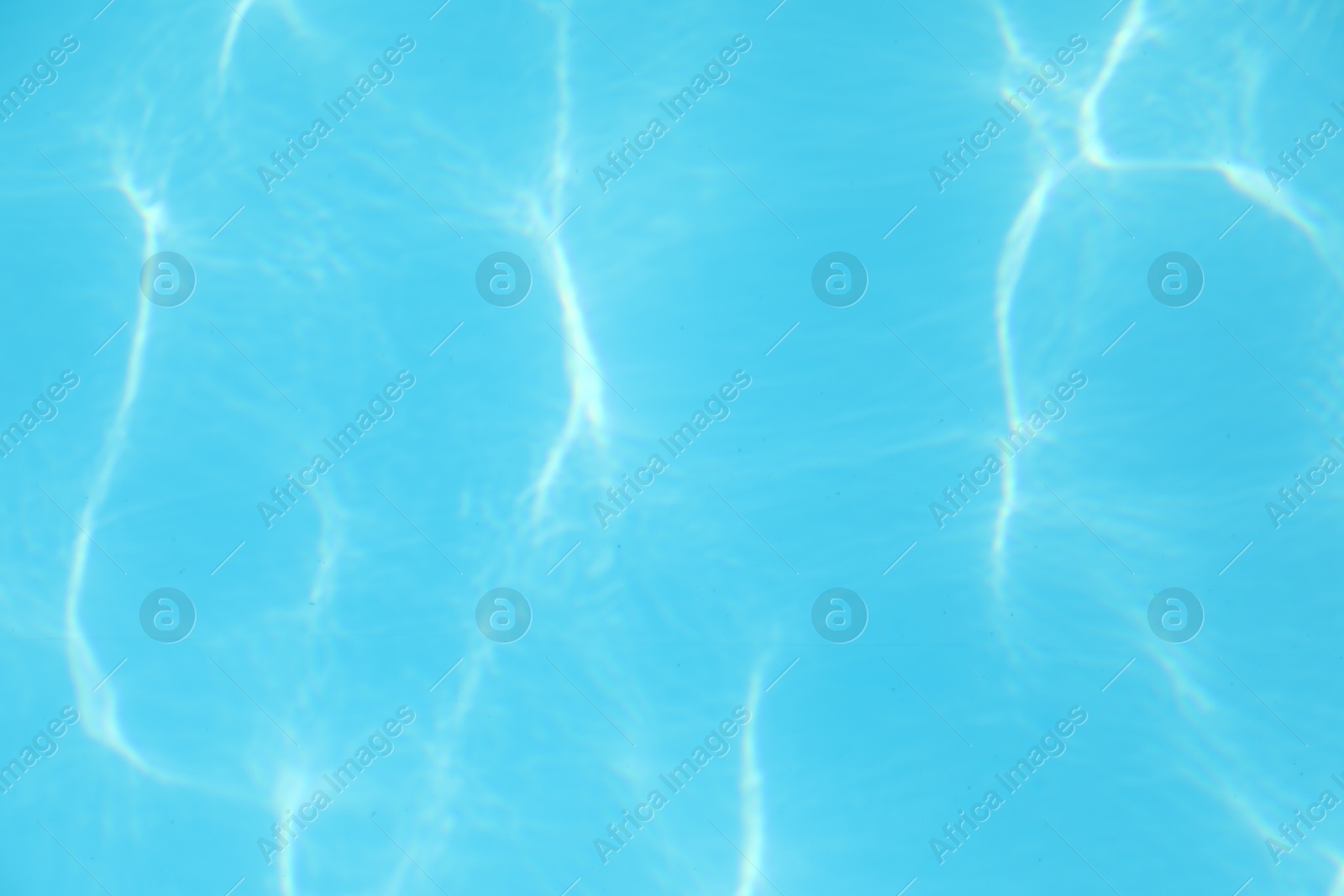 Photo of Clear water in outdoor swimming pool on sunny day