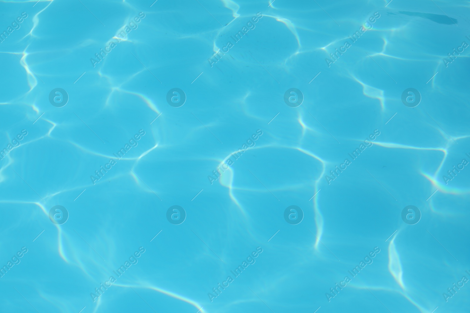 Photo of Clear water in outdoor swimming pool on sunny day