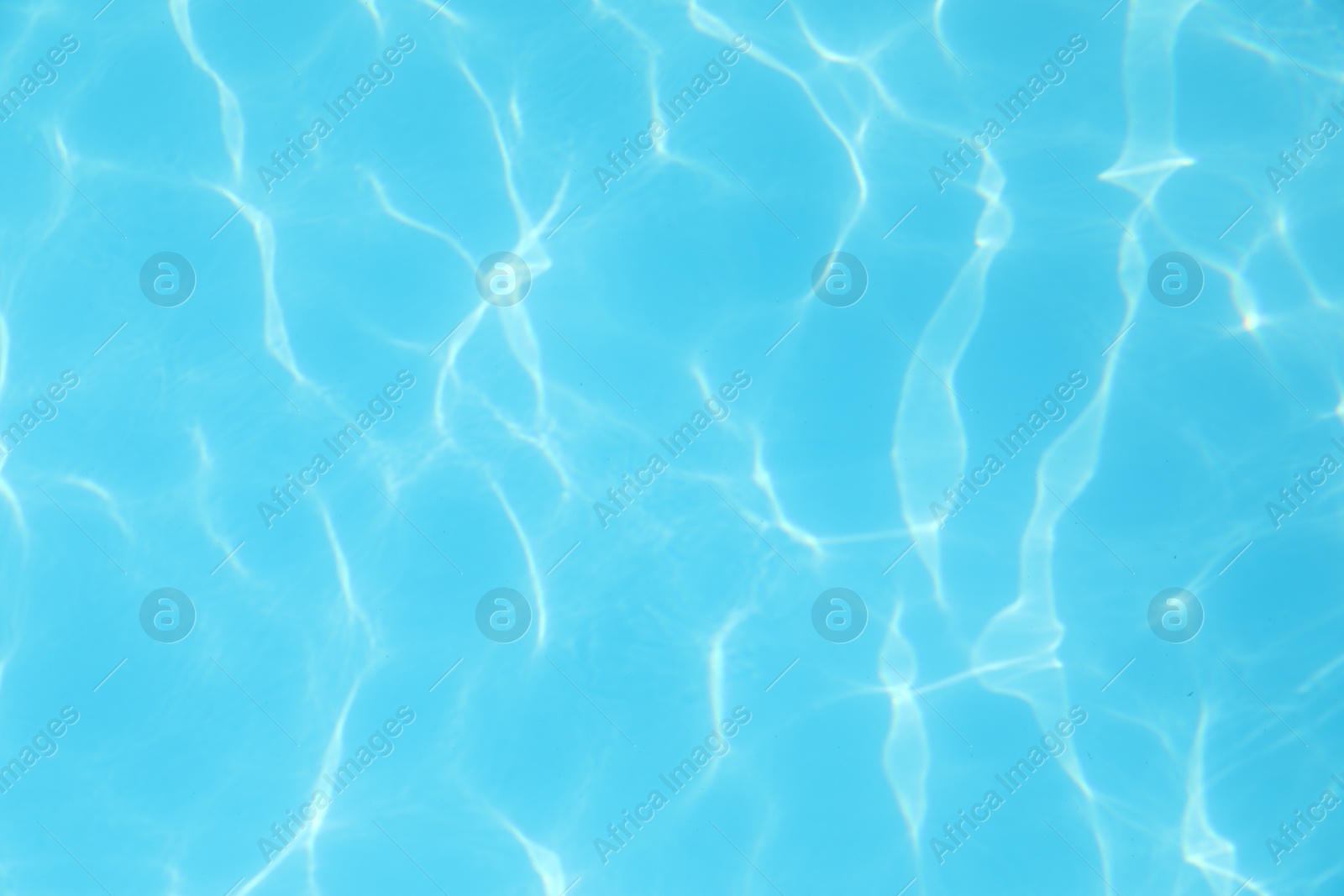 Photo of Clear water in outdoor swimming pool on sunny day