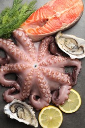 Photo of Different sea food on grey table, flat lay