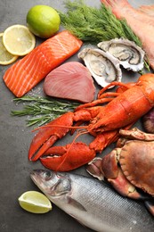 Different sea food on grey table, flat lay