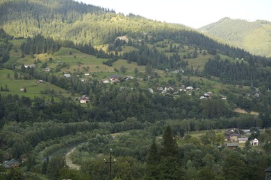 Photo of Picturesque view of mountain village and forest